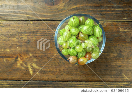 Ripe gooseberry in a glass plate, place for text, Ripe gooseberry in a glass plate, place for text, 62406655