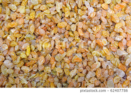 Background of raisins in sale in the shop of dried fruit. 62407786