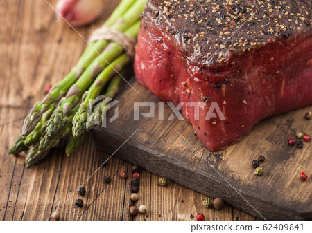 Slice of Raw Beef Topside Joint with Salt and Slice of Raw Beef Topside Joint with Salt and 62409841