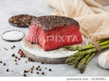 Slice of Raw Beef Topside Joint with Salt Slice of Raw Beef Topside Joint with Salt 62409861