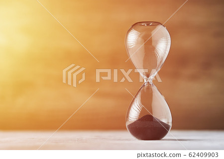 Hourglass on the wooden background with copy Hourglass on the wooden background with copy 62409903