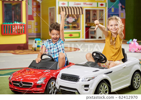 Two kids having fun in entertainment center. Two kids having fun in entertainment center. 62412970
