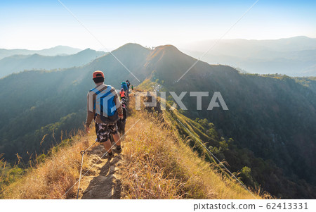 beautiful landscape with trekkers walking on mountain ridge at Khao Chang Phuak Thailand 62413331