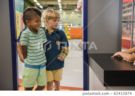 Kids playing police at indoor amusement park. Kids playing police at indoor amusement park. 62413874