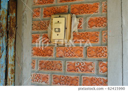 Door bell and background of old vintage red brick 62415990