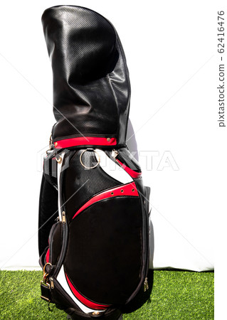 Golf bag placed on a green artificial grass means being prepared for the game of golf Golf bag placed on a green artificial grass means being prepared for the game of golf 62416476