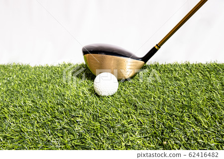A golf club that is played by people hitting a golf ball on an artificial grass. Green means being ready for the game of golf 62416482