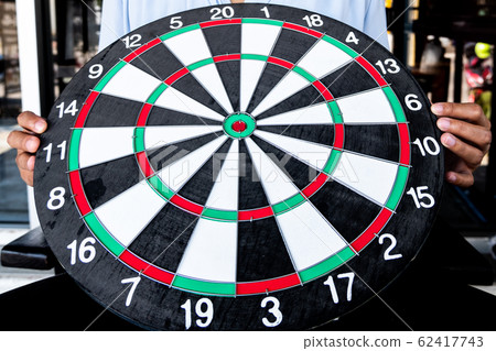 Young business women holding dartboard, Planning new business target and goals 62417743