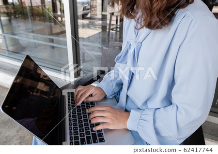 Close-up Of Young businesswomen working on laptop for online searching Close-up Of Young businesswomen working on laptop for online searching 62417744