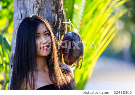 Close-up portrait of young beautiful Asian girl. Close-up portrait of young beautiful Asian girl. 62418306