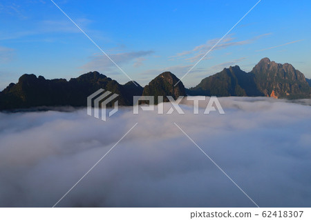 Landscape with sea of clouds in Vang Vieng, Laos Landscape with sea of clouds in Vang Vieng, Laos 62418307