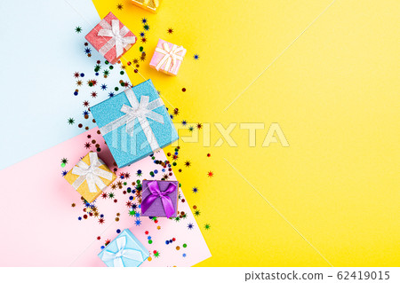 Festive background with colorful gift presents 62419015