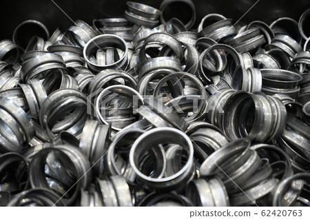 Metal pieces background. metal stamping industry. Industrial background. 62420763
