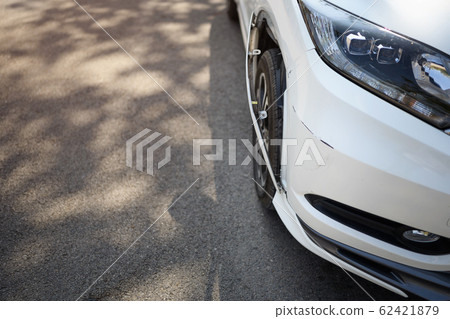 white car has a small bump crash, due to a slight white car has a small bump crash, due to a slight 62421879