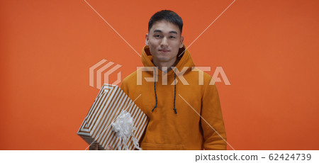 Young man catching box 62424739
