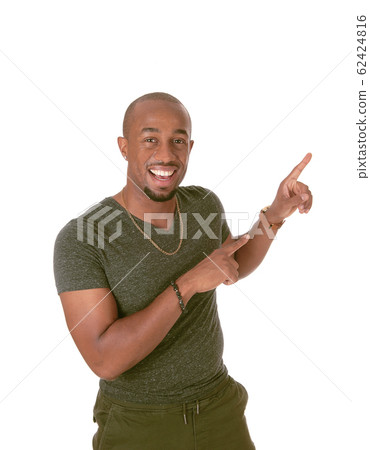 An African man standing and pointing with his An African man standing and pointing with his 62424816