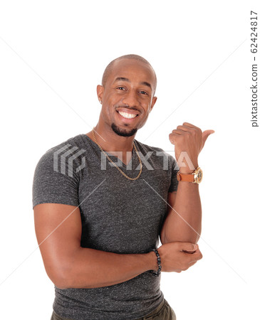 An African man standing and pointing with his hand An African man standing and pointing with his hand 62424817