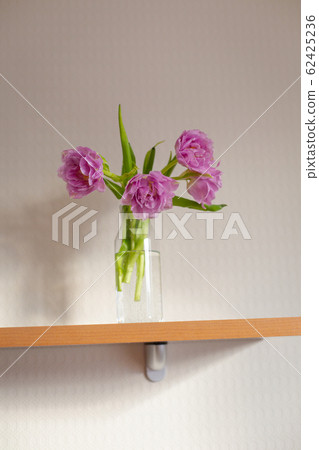 Spring tulips on the table at the daylight. 62425236