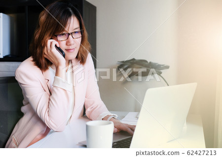 asian adult entrepreneur work on laptop and mobile asian adult entrepreneur work on laptop and mobile 62427213