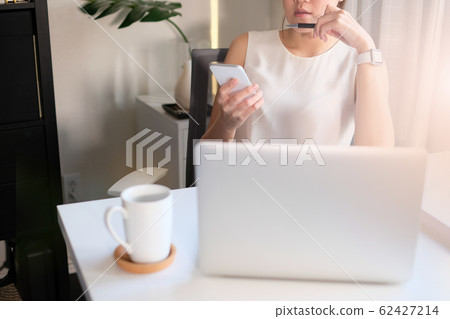asian adult entrepreneur work on laptop and mobile asian adult entrepreneur work on laptop and mobile 62427214