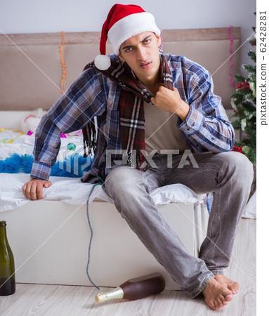 Man suffering hangover after christmas party 62428281