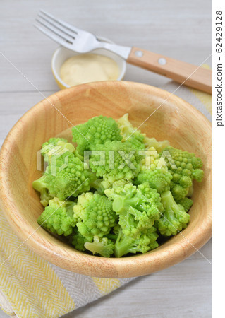 Boiled Romanesco (vegetables). Cooked, vegetable salad. It is a kind of cauliflower. Serve with mayonnaise. Boiled Romanesco (vegetables). Cooked, vegetable salad. It is a kind of cauliflower. Serve with mayonnaise. 62429128