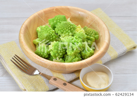 Boiled Romanesco (vegetables). Cooked, vegetable salad. It is a kind of cauliflower. Serve with mayonnaise. Boiled Romanesco (vegetables). Cooked, vegetable salad. It is a kind of cauliflower. Serve with mayonnaise. 62429134