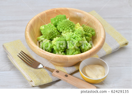 Boiled Romanesco (vegetables). Cooked, vegetable salad. It is a kind of cauliflower. Serve with mayonnaise. 62429135