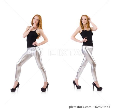 Young redhead girl in tight leggings 62429334