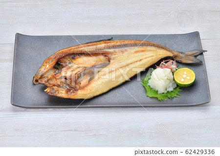 Baked hockey (string) dried fish. Grilled fish, Japanese food, fish dishes. 62429336