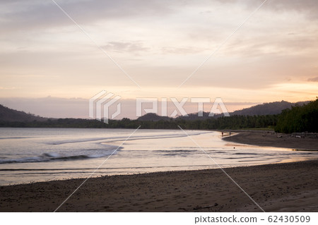 Sunset at Tambor Beach, in the Pacific of Costa 62430509