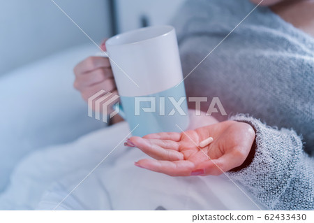 Sick asian woman have hight fever flu and take Sick asian woman have hight fever flu and take 62433430