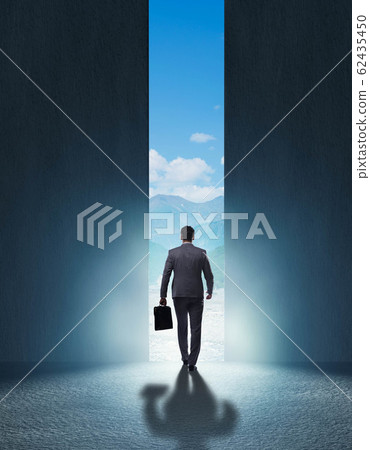 Businessman walking towards his ambition Businessman walking towards his ambition 62435450