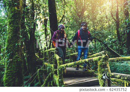 Couples traveling, relax in winter. walking travel to study nature in the rainforest. at the angka, Couples traveling, relax in winter. walking travel to study nature in the rainforest. at the angka, 62435752