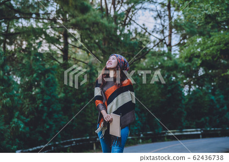 Asian woman travel nature. Travel relax. Study read a book. Nature Education Write a note 62436738