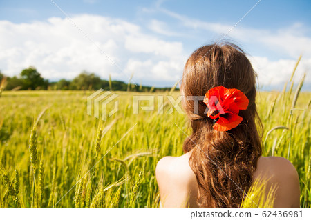 Beautiful girl is standing with her back in a Beautiful girl is standing with her back in a 62436981