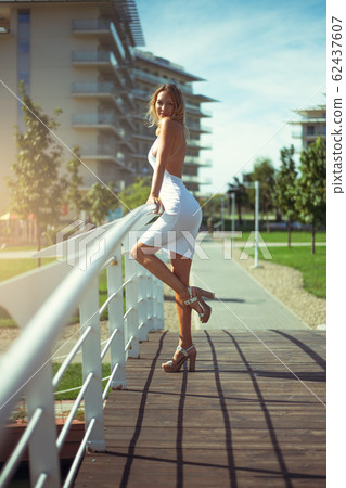 Beautiful young woman in a blonde in a sexy trendy 62437607