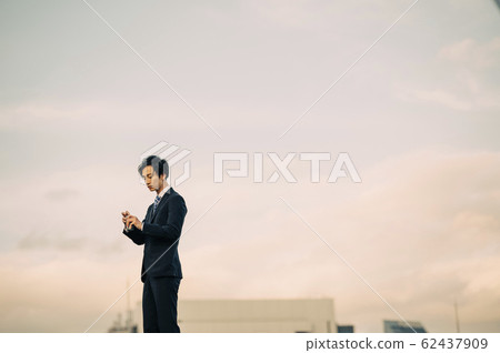 A businessman outdoors 62437909