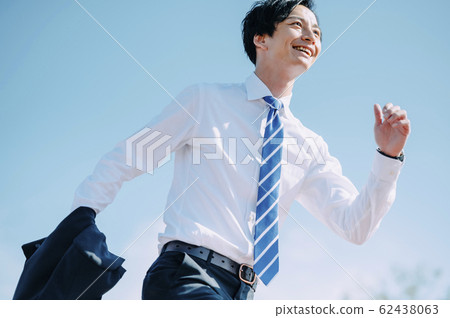 Refreshing businessman Refreshing businessman 62438063