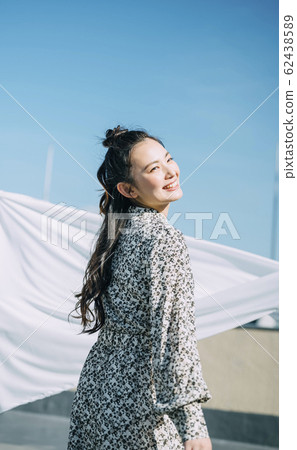 Portrait of a woman outdoors 62438589