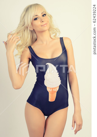 beautiful slim girl in a black bathing suit beautiful slim girl in a black bathing suit 62439224