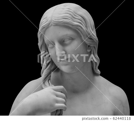 White marble sculpture head of young woman. Statue of sensual renaissance art era naked woman in circlet antique style isolated on black background 62440118