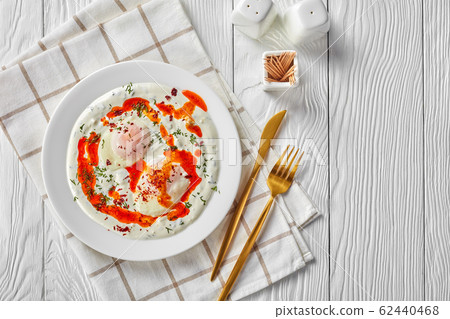 cilbir, poached eggs in dill yogurt sauce 62440468