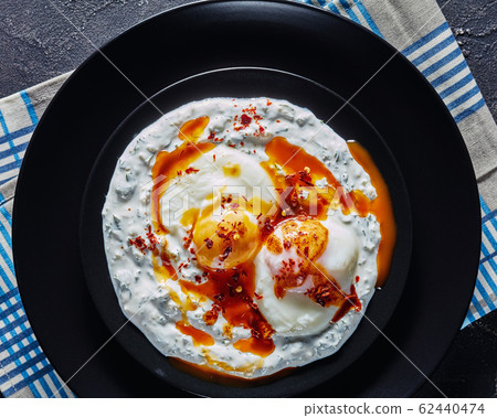 cilbir, poached eggs in dill yogurt sauce cilbir, poached eggs in dill yogurt sauce 62440474