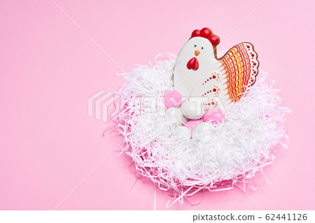 Stylish pink background with various easter cookies Stylish pink background with various easter cookies 62441126