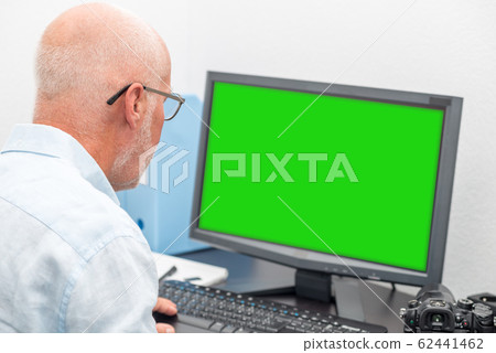 Businessman with glasses using computer 62441462