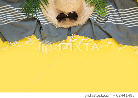 Beach straw sun hat on yellow 62441495