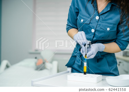 beautician is gaining blood in syringe from tube test beautician is gaining blood in syringe from tube test 62441558