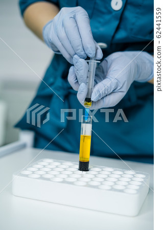 beautician is gaining blood in syringe from tube test beautician is gaining blood in syringe from tube test 62441559