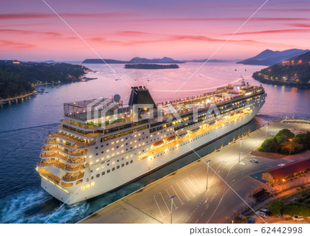 Aerial view of cruise ship in port at night in Dubrovnik. Ships and boats Aerial view of cruise ship in port at night in Dubrovnik. Ships and boats 62442998